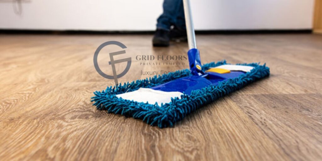 A person mops a wooden floor, demonstrating effective cleaning techniques and maintaining a tidy living space